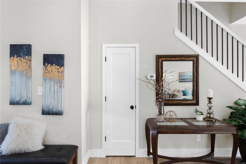 Entry hall with console table and staircase