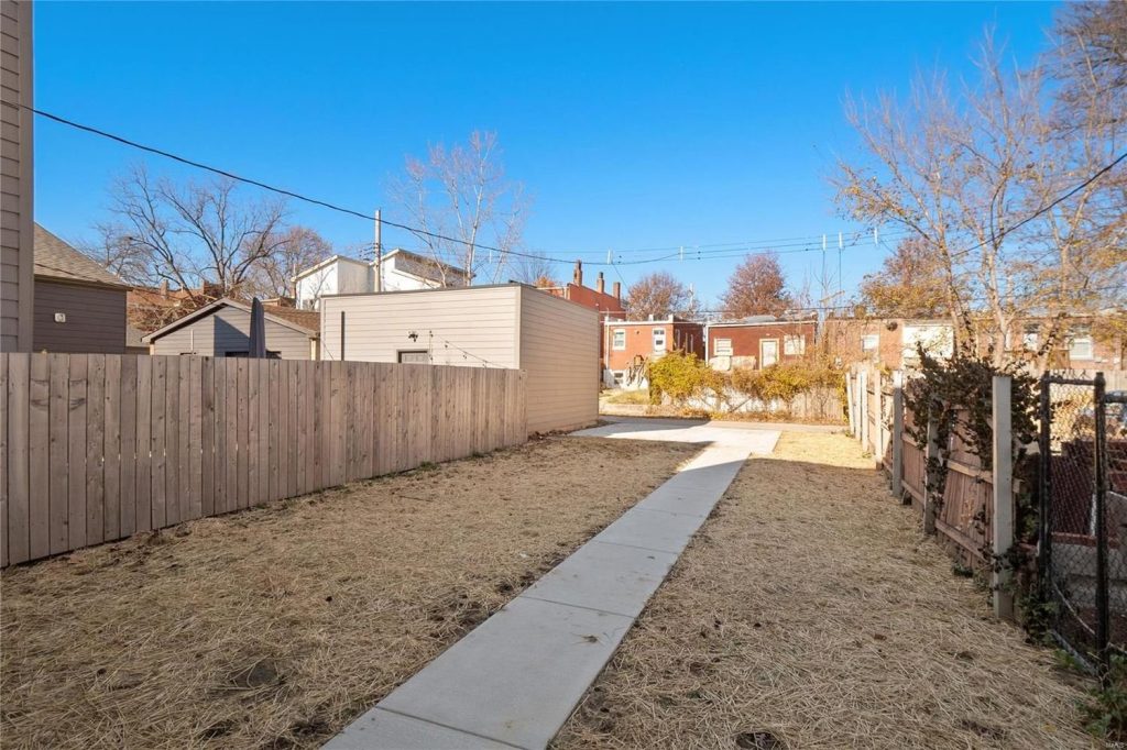 Rear yard with new path and fencing