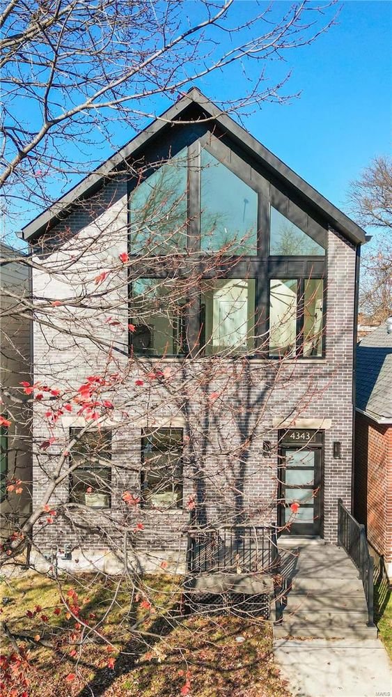 New build front elevation with double height windows