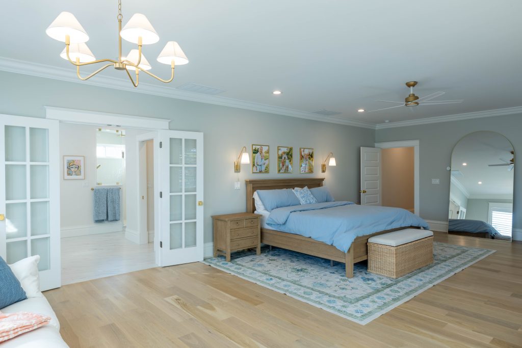 Primary bedroom with French doors opening to the bath