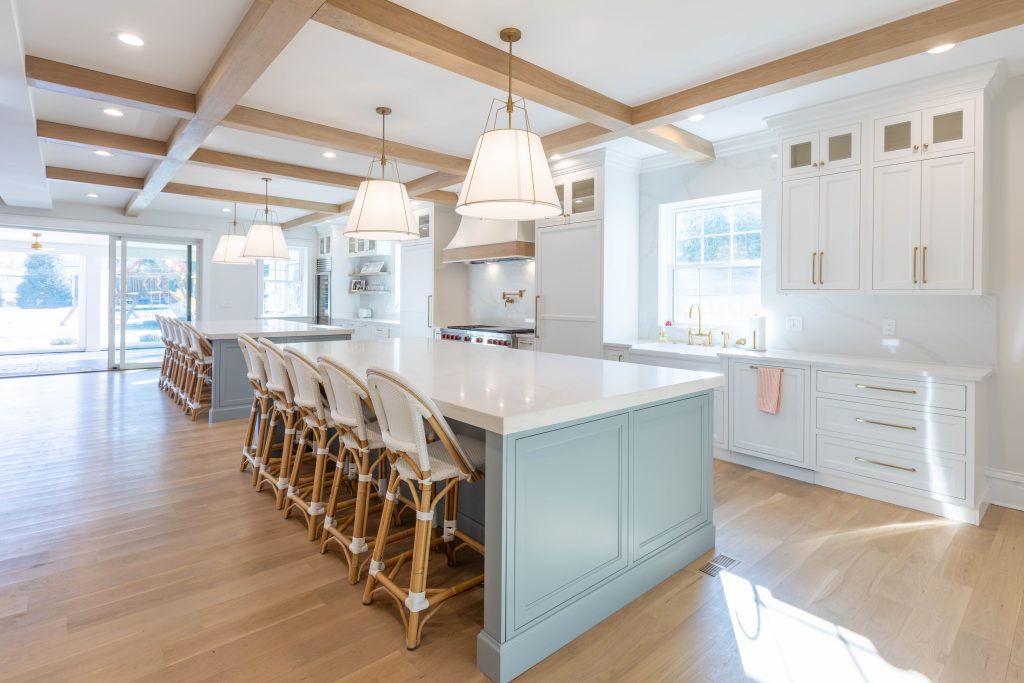 Twin kitchen islands with rattan counter stools