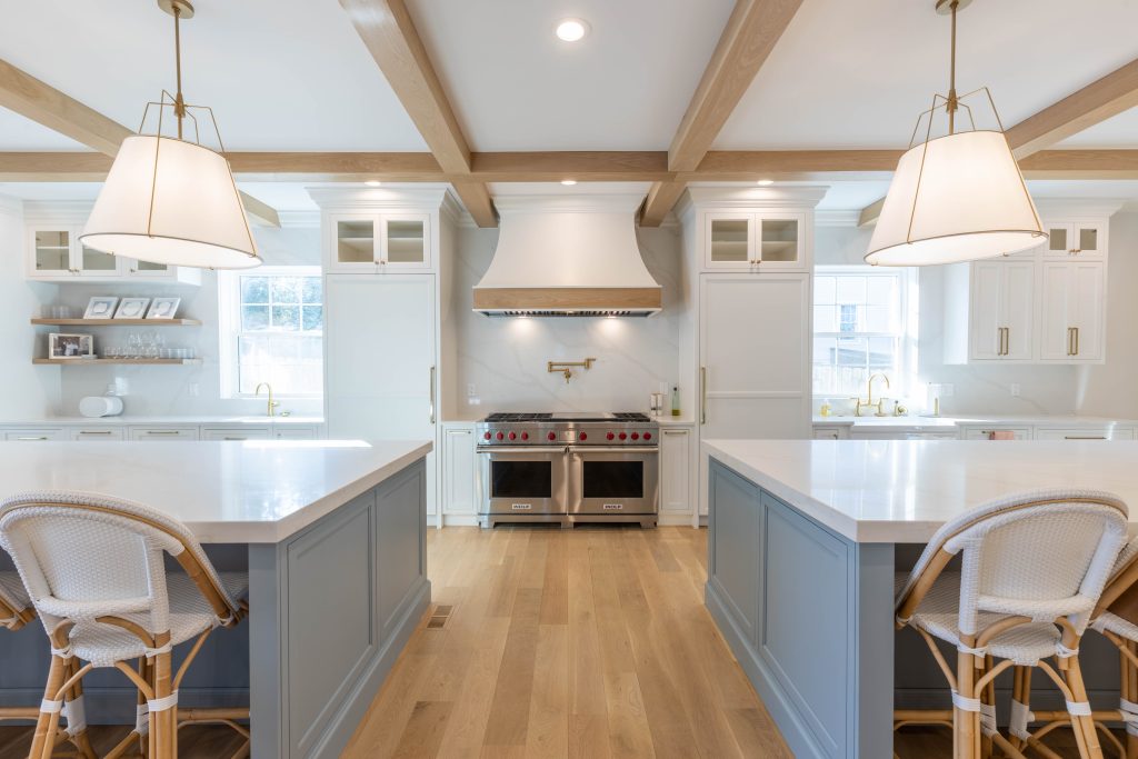 Professional range and hood set between two islands