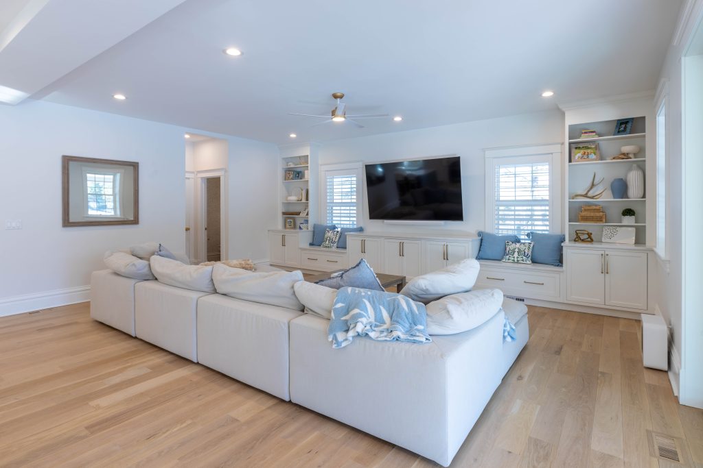 Family room with sectional sofa and built-in window seats