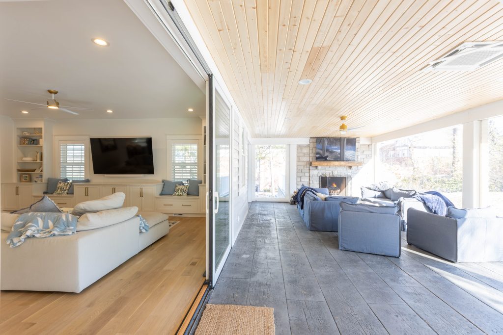 Open sliding doors joining family room and porch