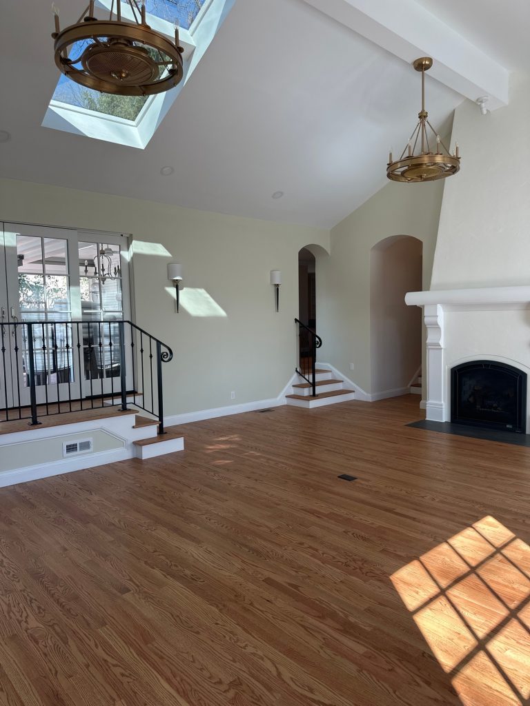 Great room with stepped entry and arched doorways
