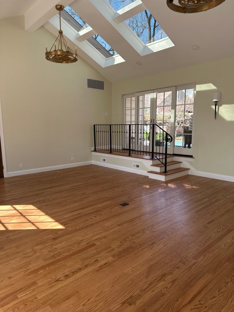 Skylit room overlooking the pool through French doors