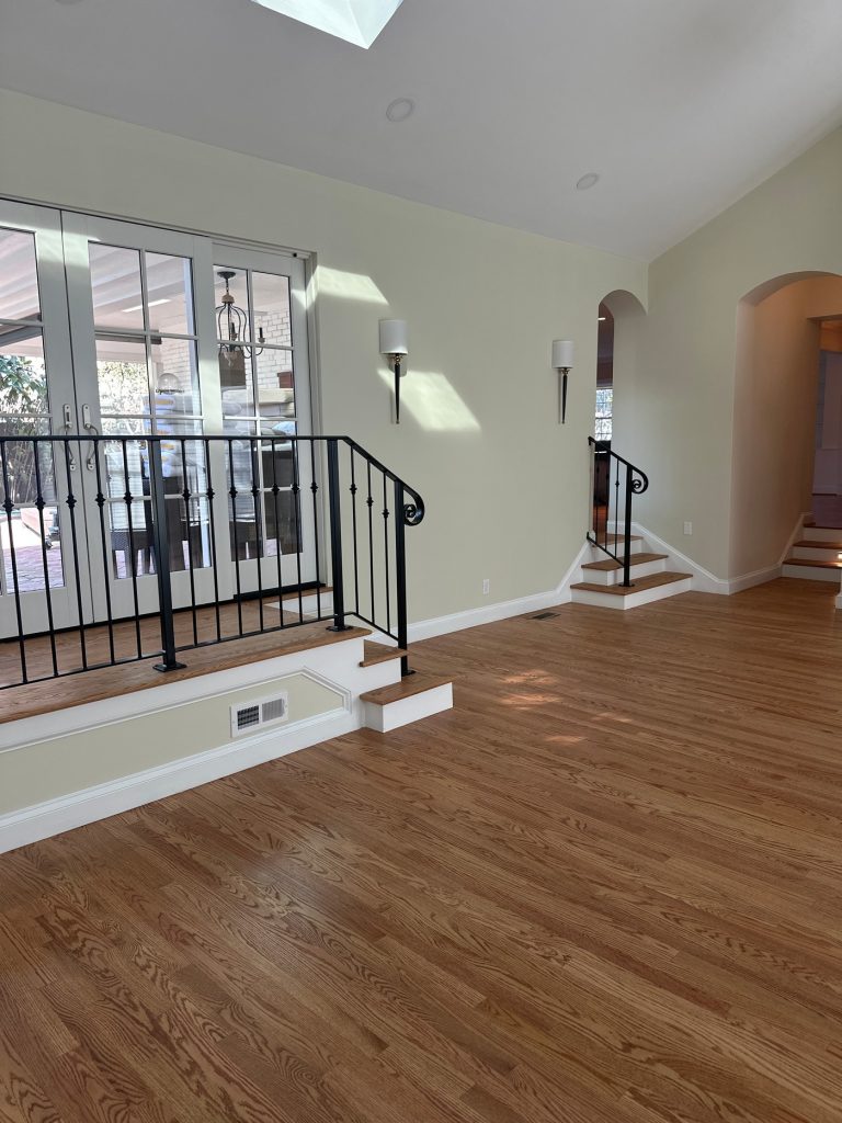 Iron railing beside French doors to the covered patio