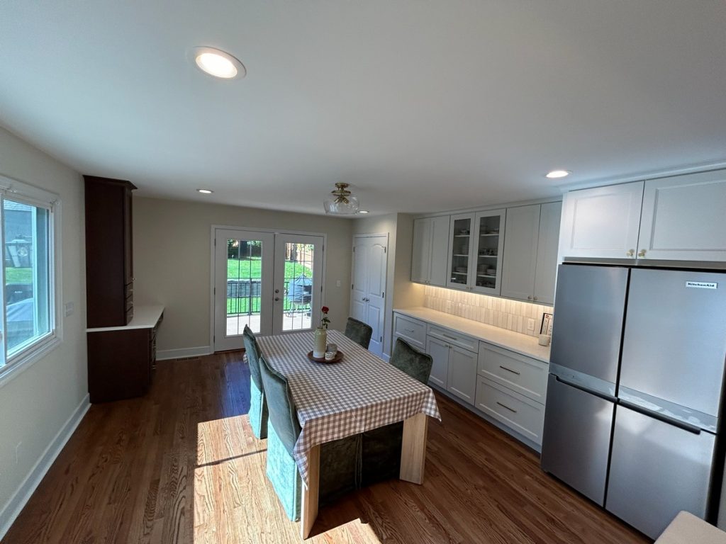 Dining area with glass-front cabinets and counter run