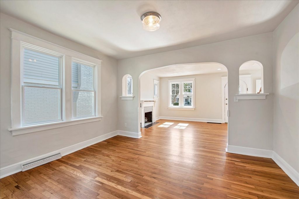 Living room arch opening toward the tiled fireplace