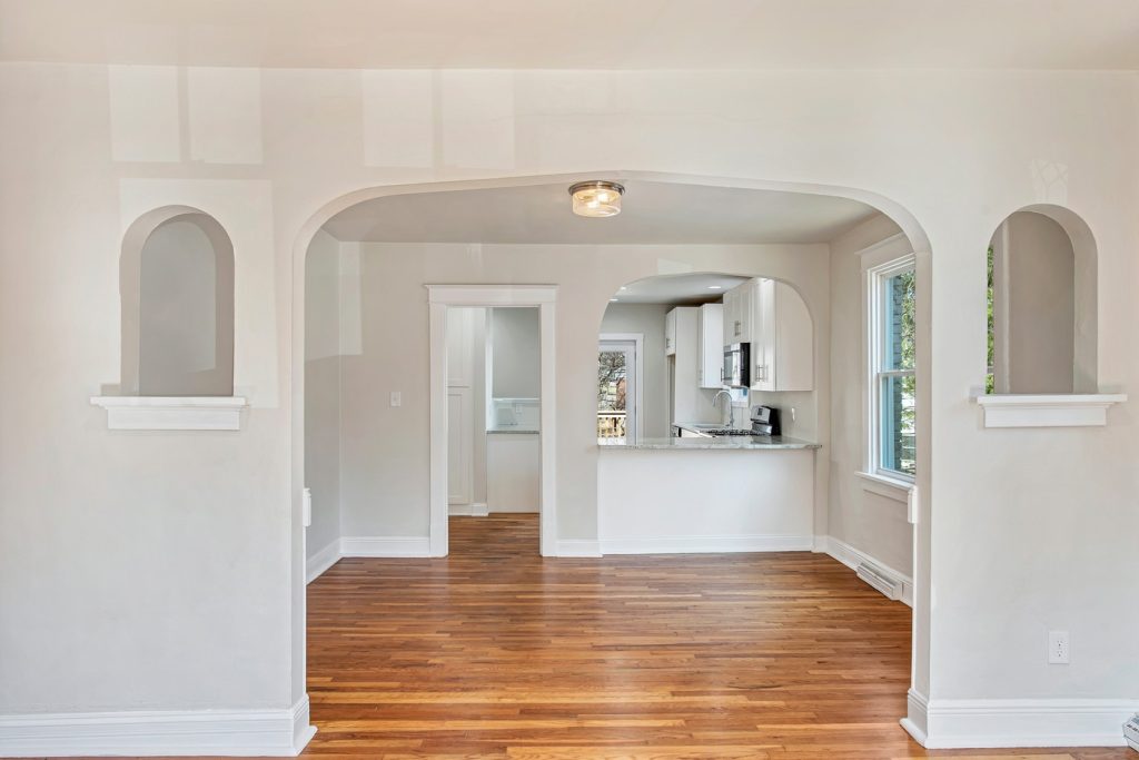 Plaster archway and niches framing the kitchen
