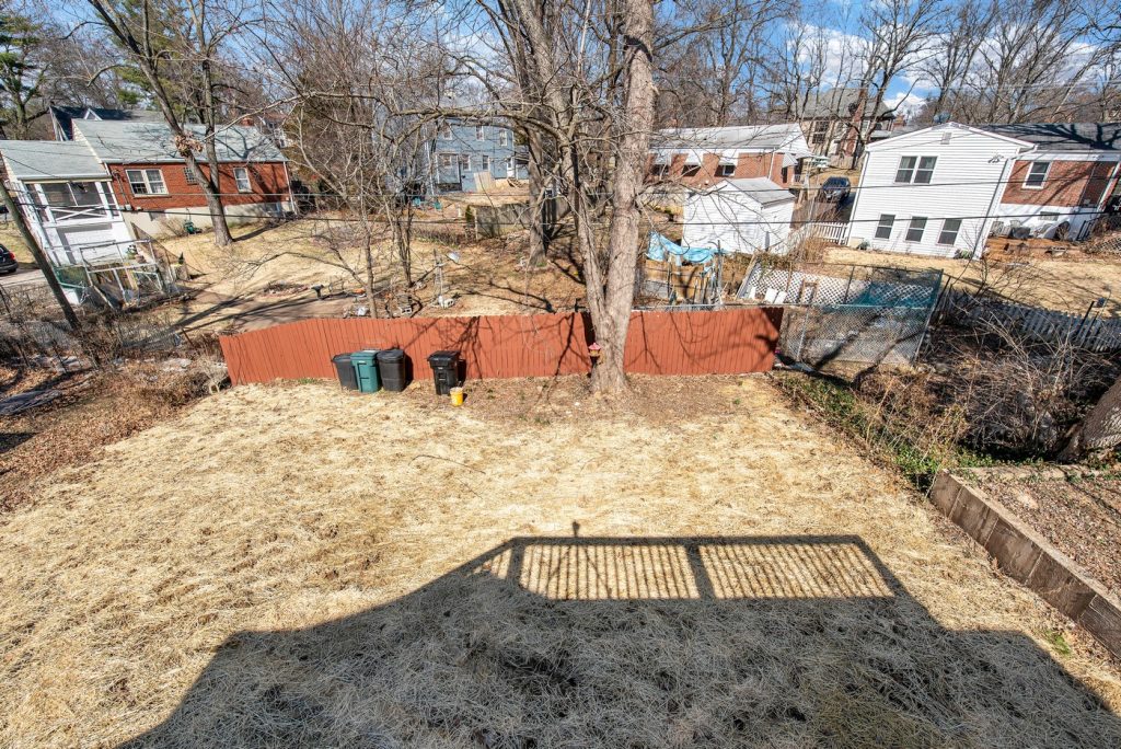 Fenced rear yard seen from the new deck