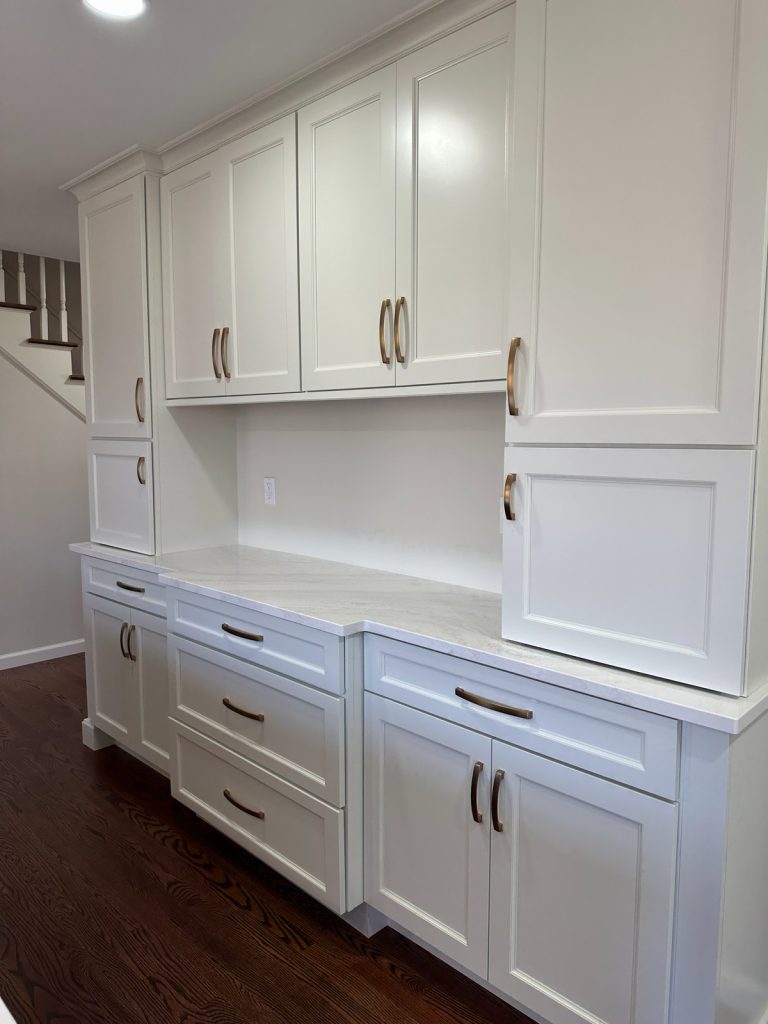 Butler's pantry cabinetry beside the staircase