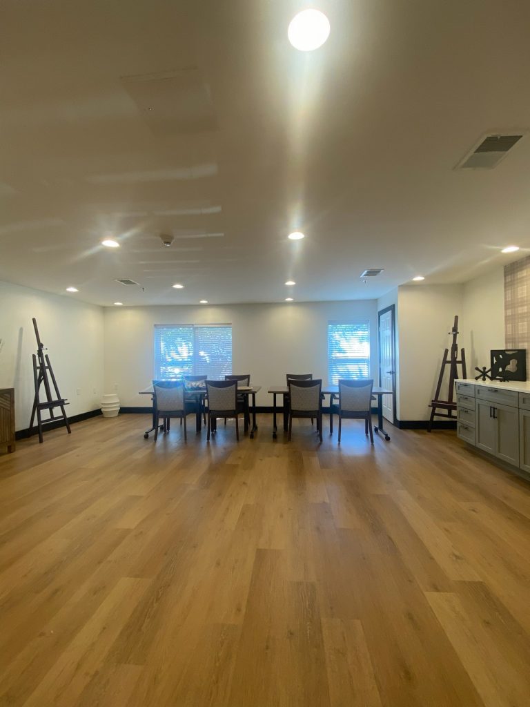 Activity room seating with plaid feature wall