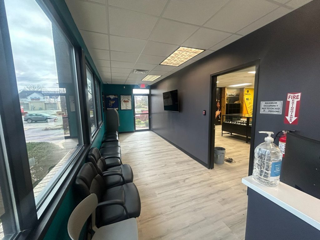 Waiting area with seating along the window wall