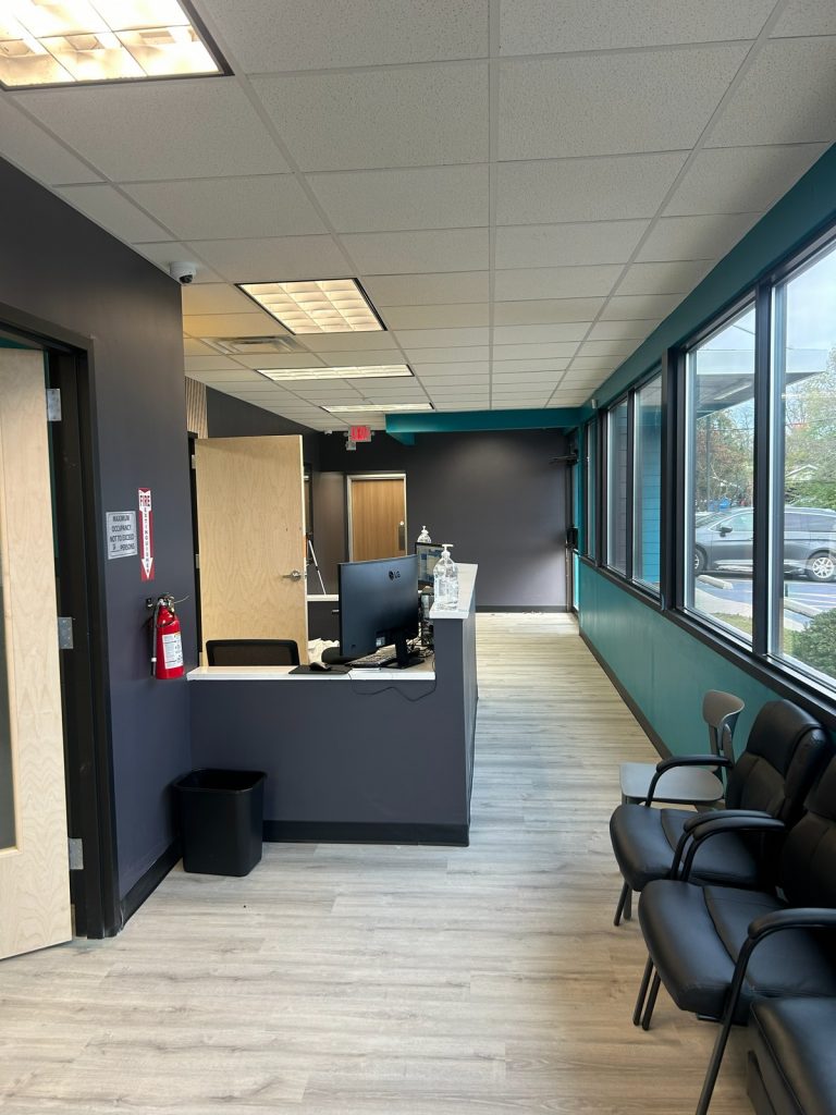 Reception counter beside the waiting room chairs
