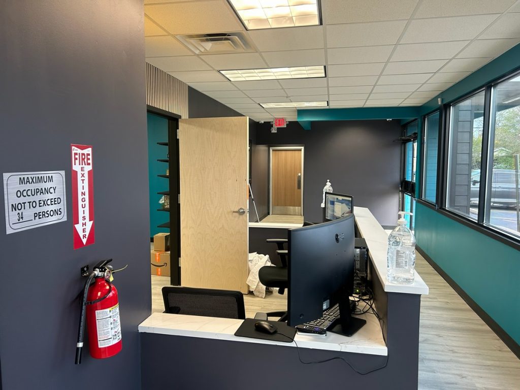 Reception desk with monitors and stone countertop