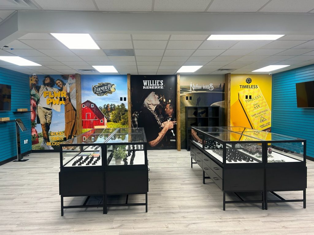 Display cases in front of the brand mural wall