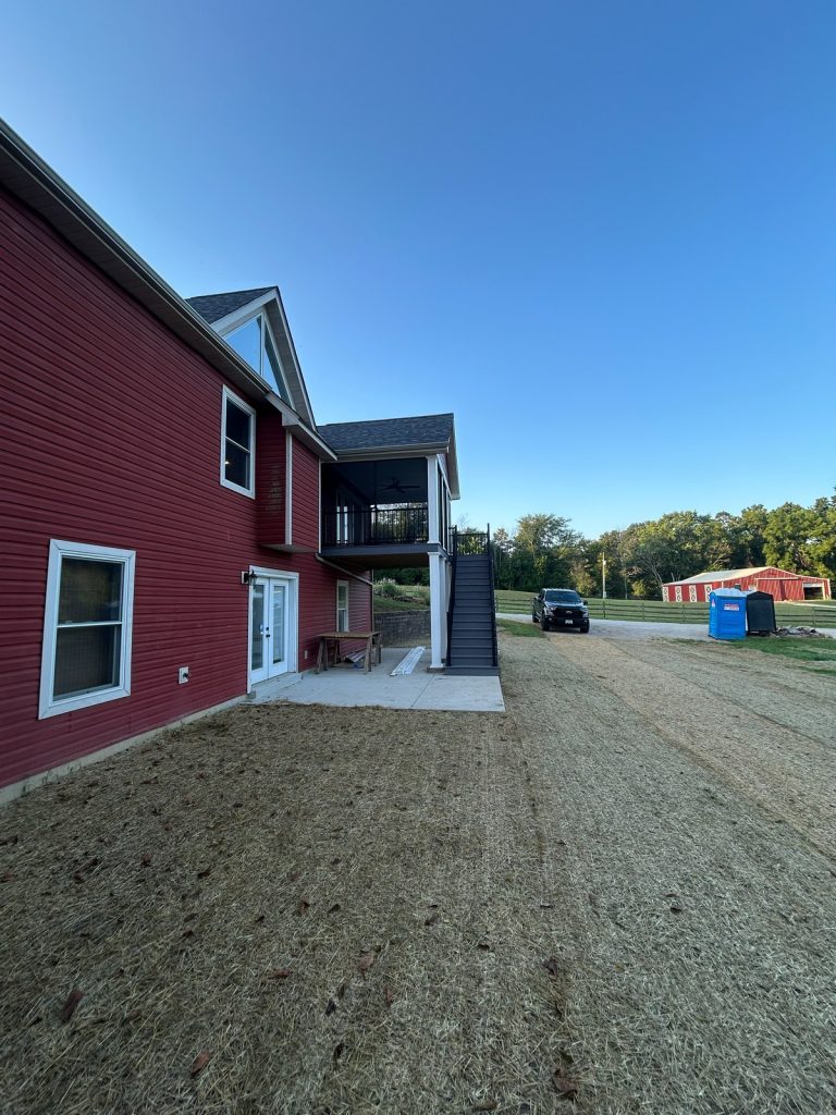 Rear elevation with raised deck and open stair