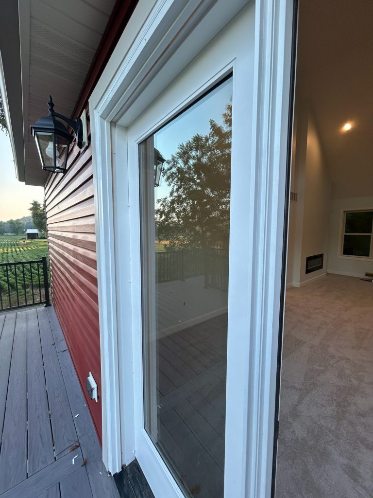 New patio door opening onto the deck at sunset