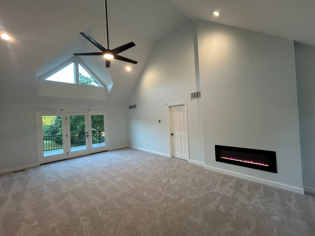 Vaulted room with the linear fireplace lit