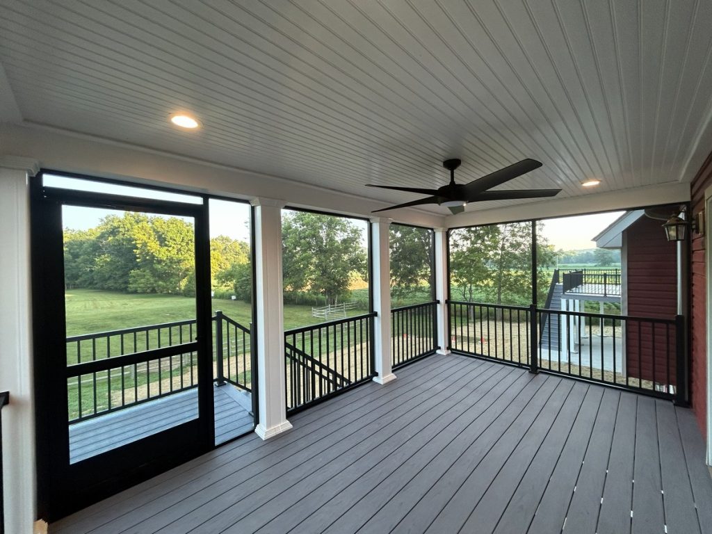 Screened porch with ceiling fan and composite decking