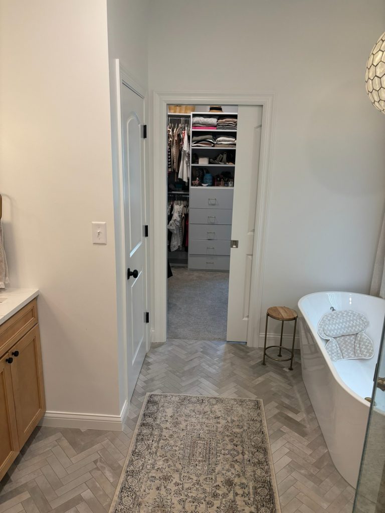 Bathroom looking through to the walk-in closet