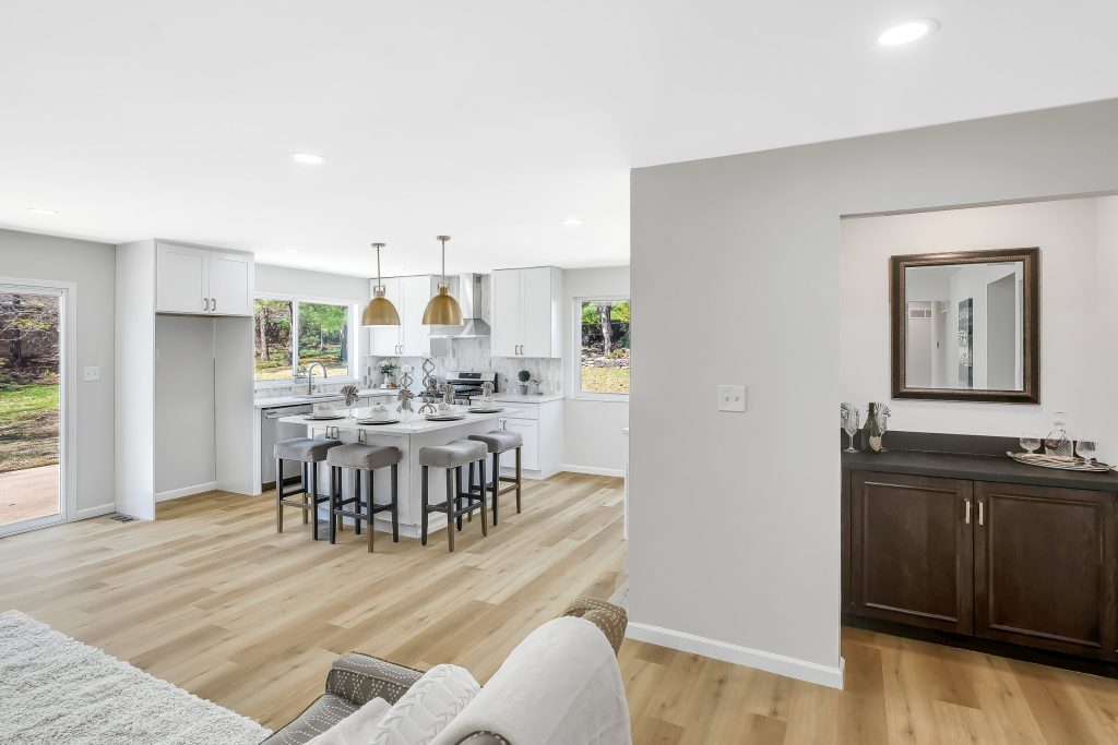 Kitchen island with stools and dark wood cabinet