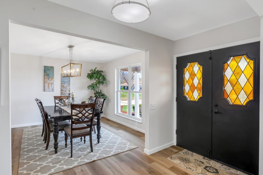 Dining area with stained glass front door