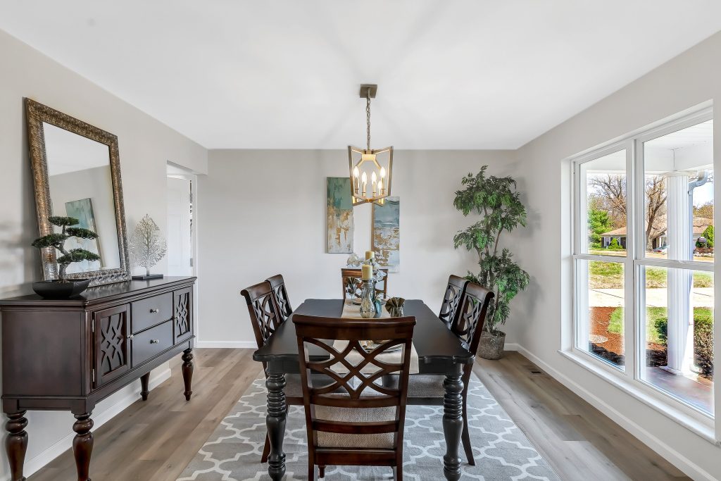 Dining room with wood sideboard and chandelier