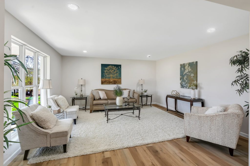 Living room with sofas, armchairs and console table