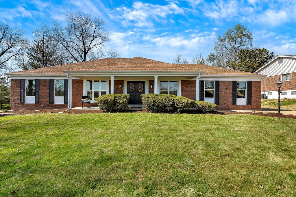 Brick ranch house front elevation and lawn