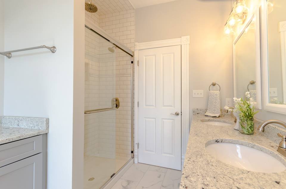 Bathroom with glass shower enclosure and granite vanity top