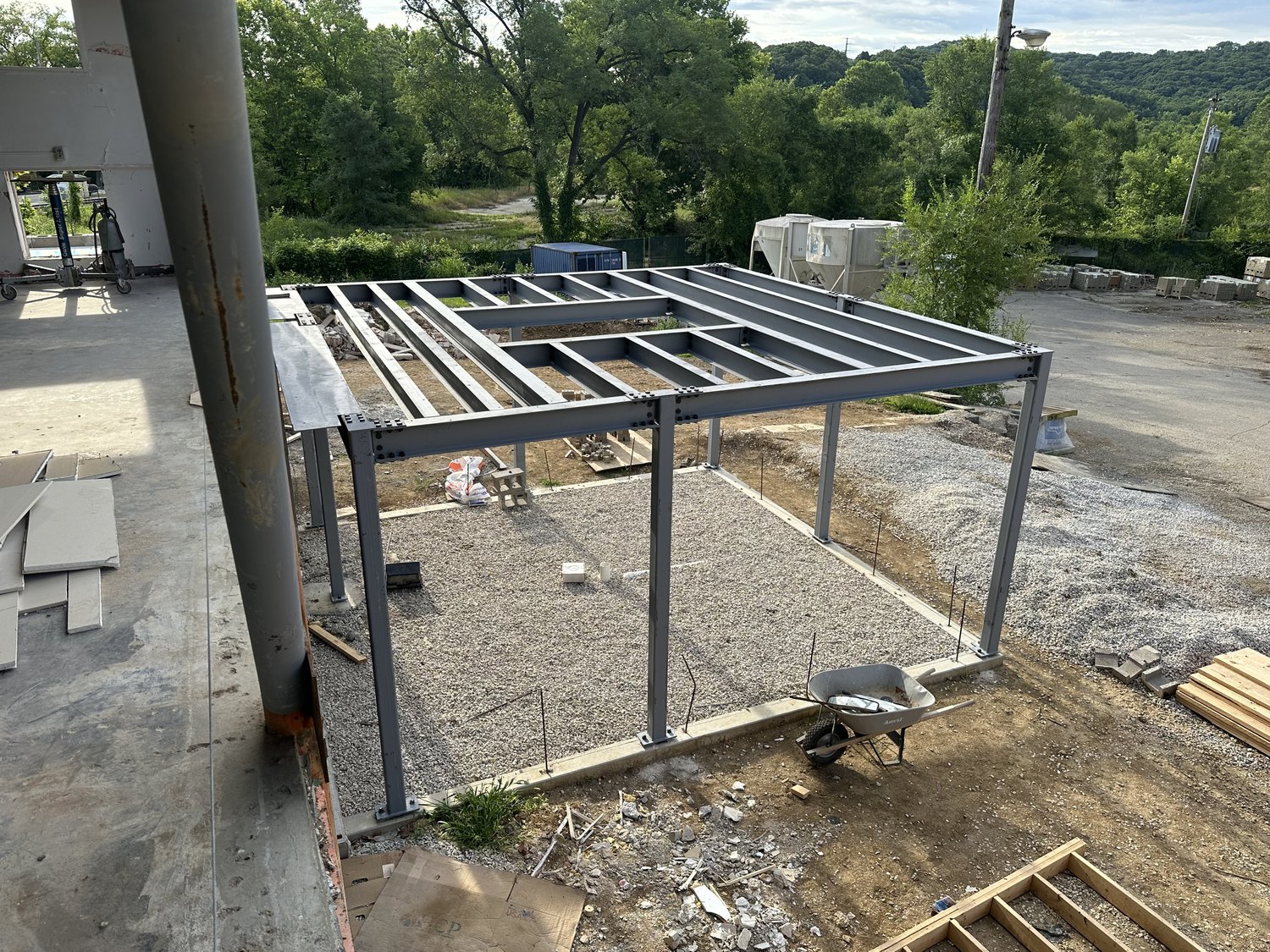Structural steel frame for a commercial addition on a prepared slab