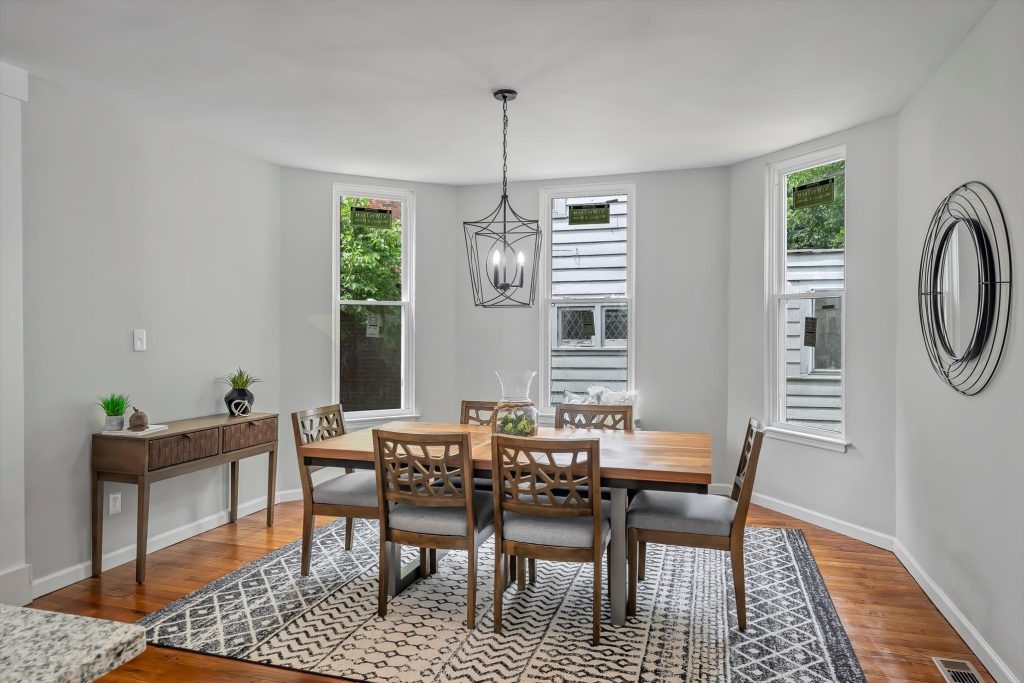 Dining room with bay window and lantern pendant light