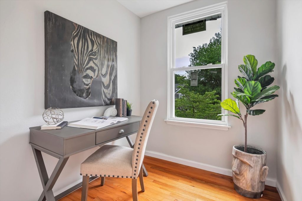 Home office corner with desk, chair and potted fig