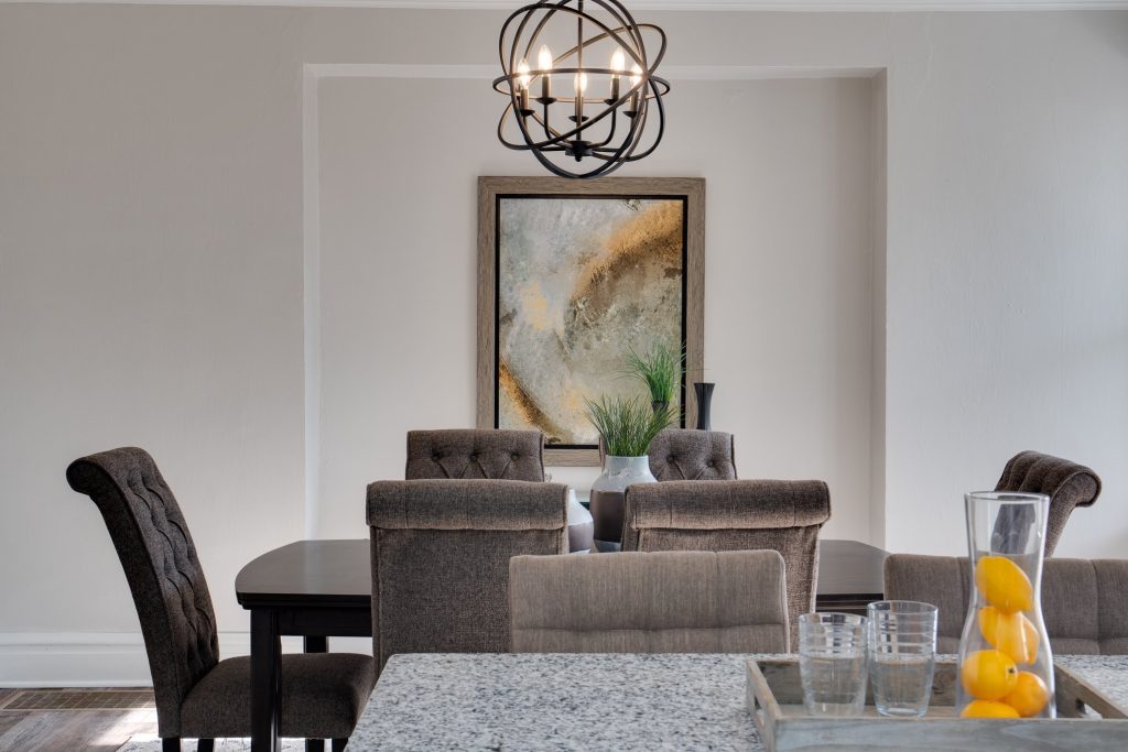 Dining table beyond the kitchen island countertop