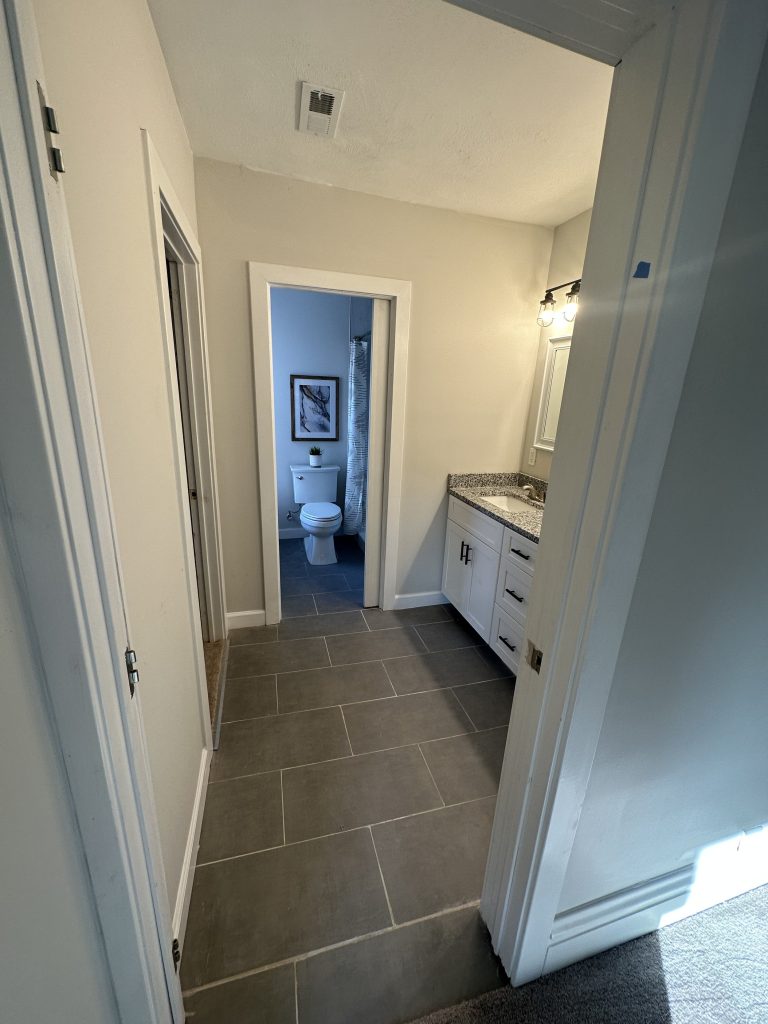 Hallway looking through to the bathroom vanity