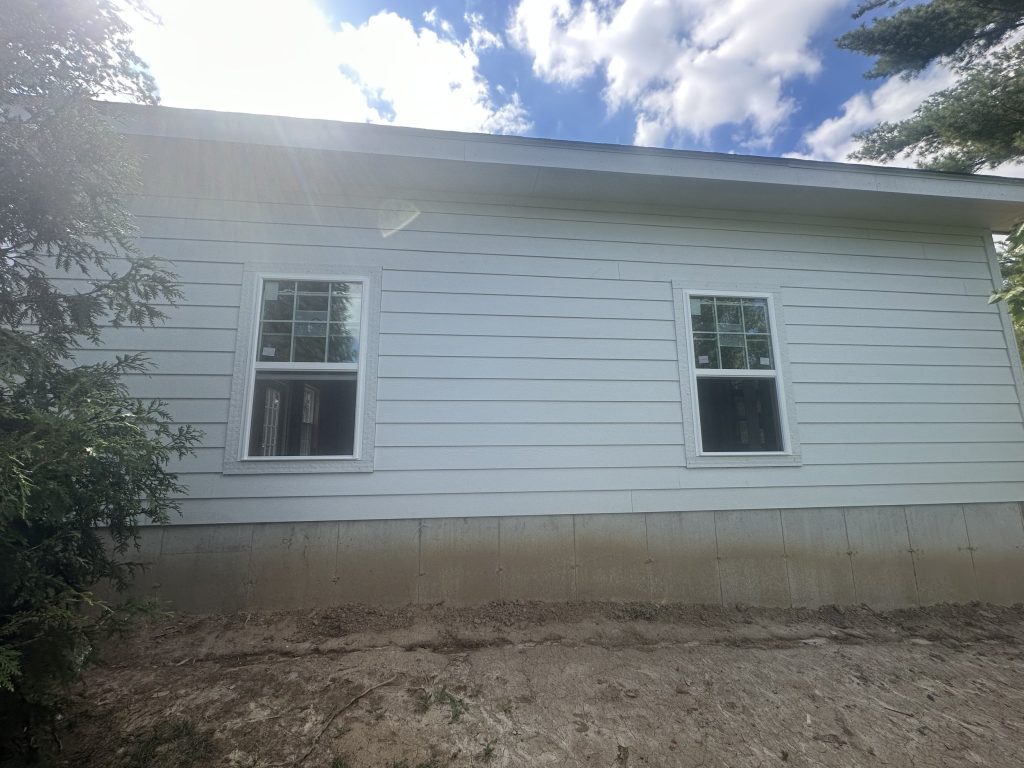 Workshop side wall with two windows and new grading
