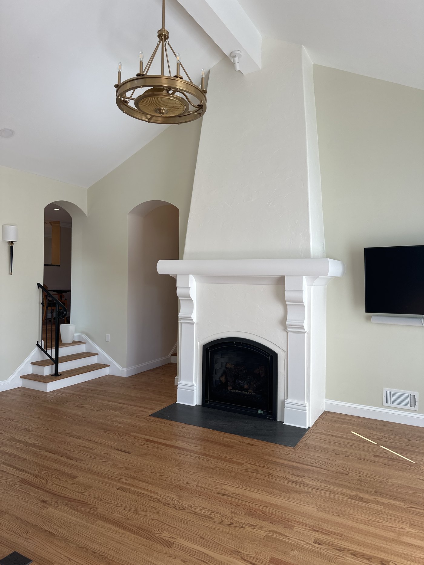 Fireplace and hardwood flooring in a renovated older St. Louis home