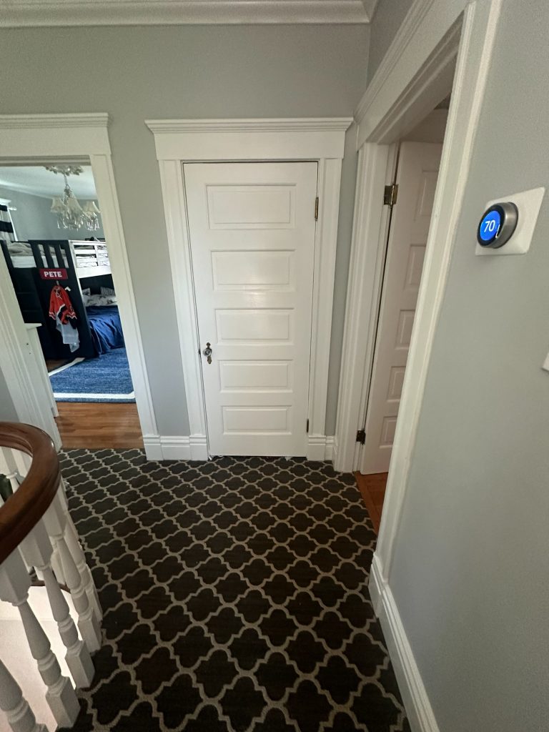 Original hallway with patterned carpet