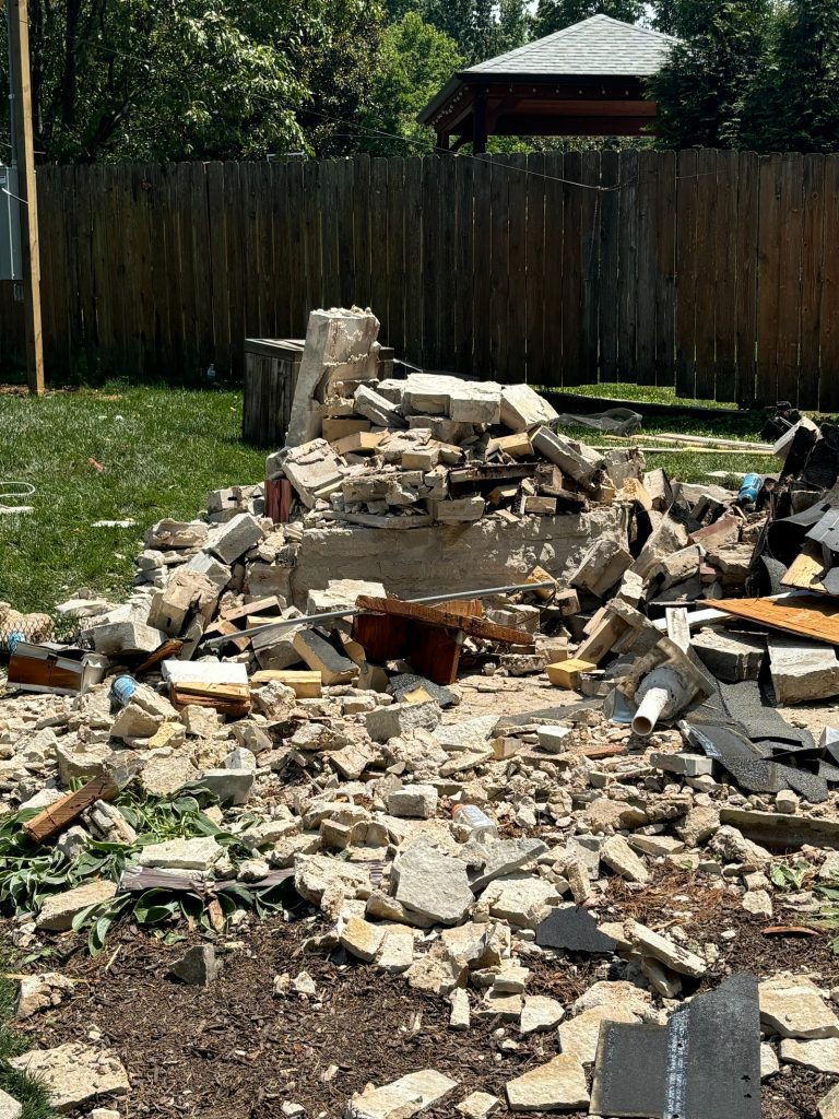 Pile of stone and lumber from the demolition