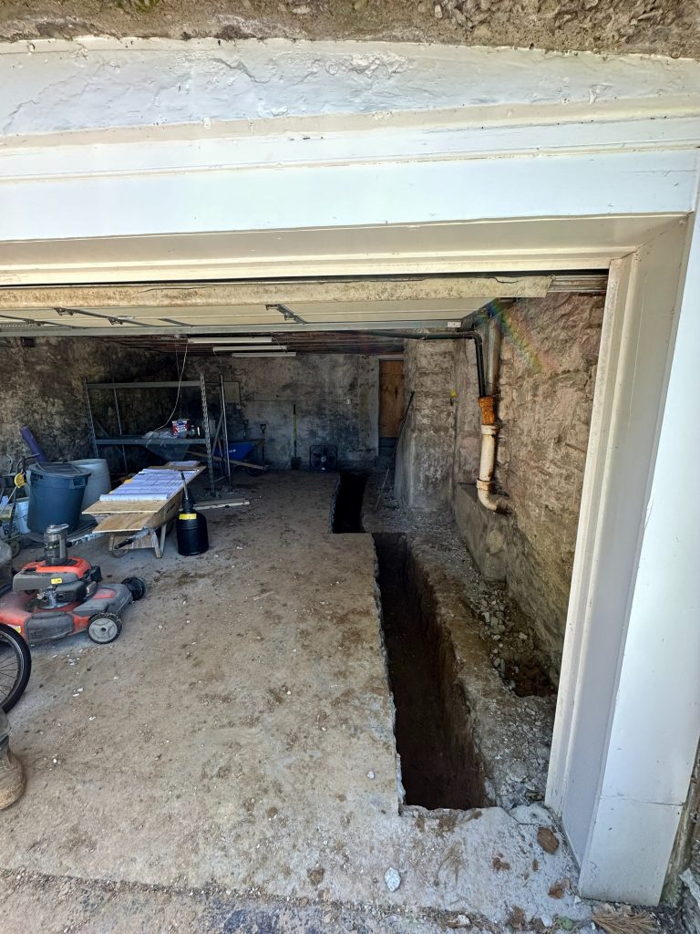 Underpinning trench running along the basement wall