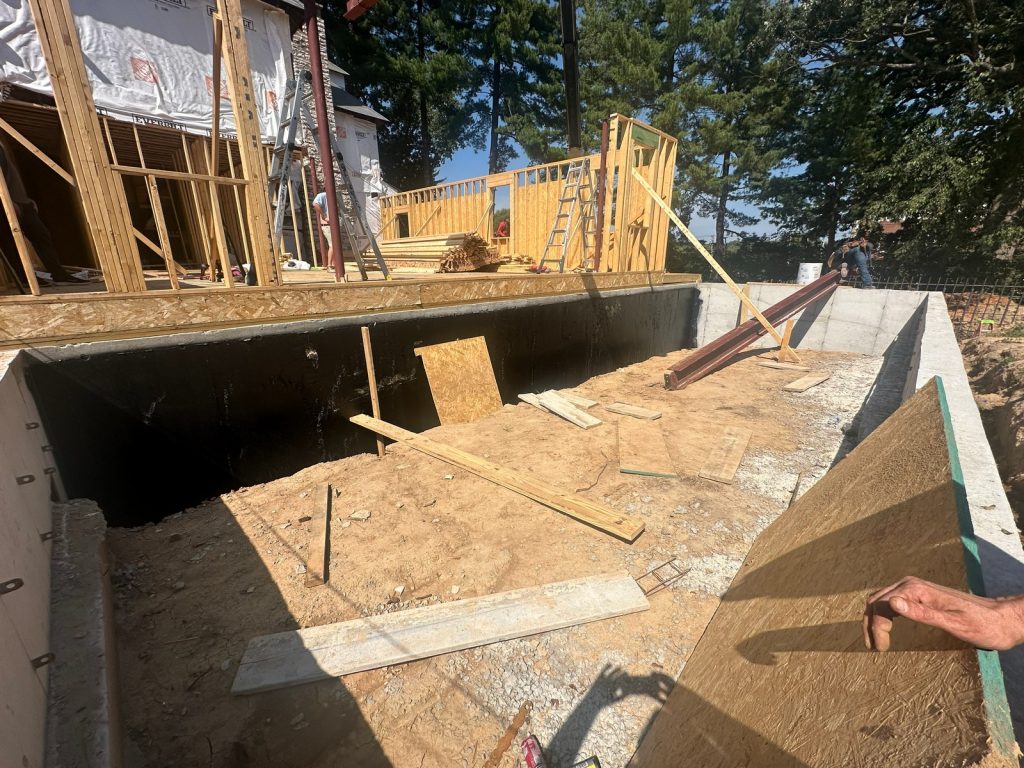 New foundation formwork and concrete being placed
