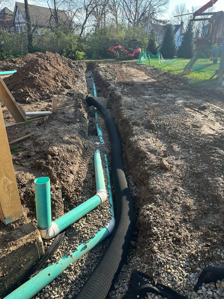Drainage and utility runs laid in gravel