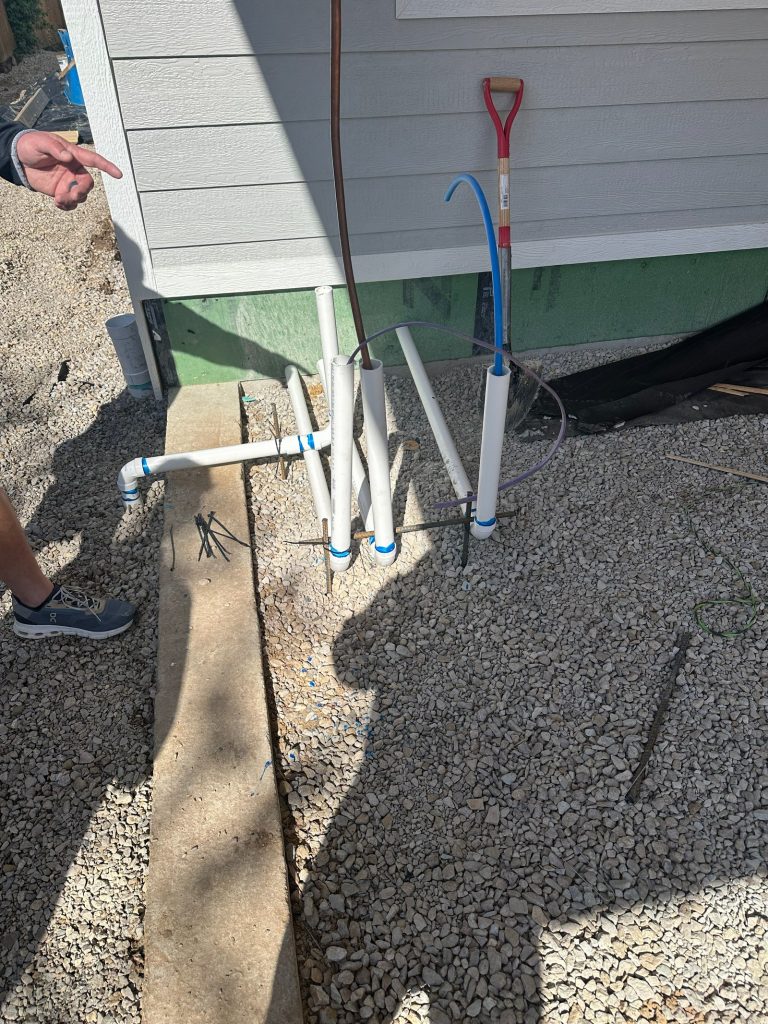 New service pipes stubbed up beside the house