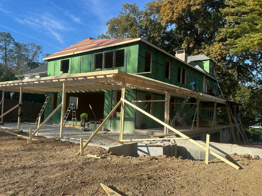 The original house raised on temporary cribbing so it could be leveled
