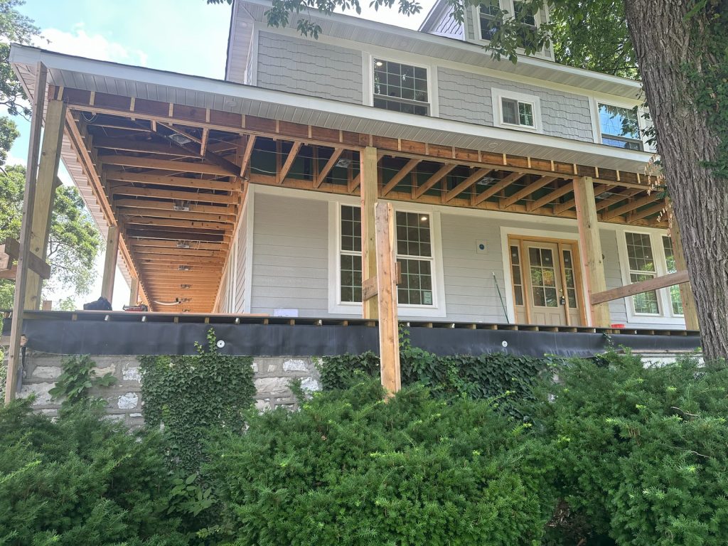 Framing for the new porch roof beside the new windows