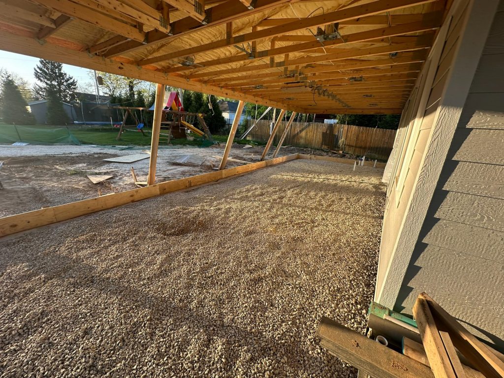 Framed floor structure over gravel at the new porch