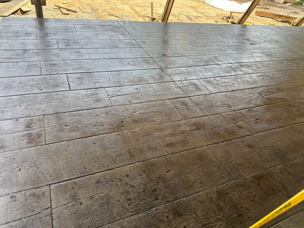 Wood-patterned stamped concrete on the new patio
