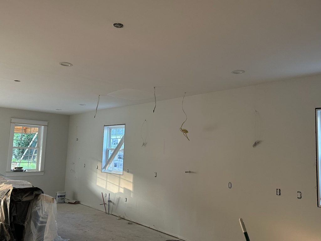 Drywalled room with electrical rough-in and new windows